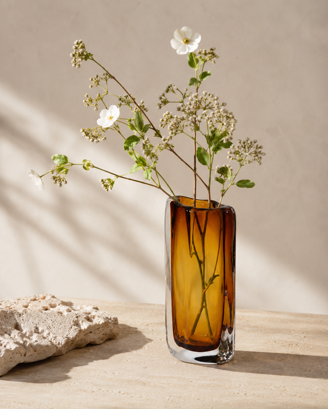 Zara Amber Vase with stems on a tabletop