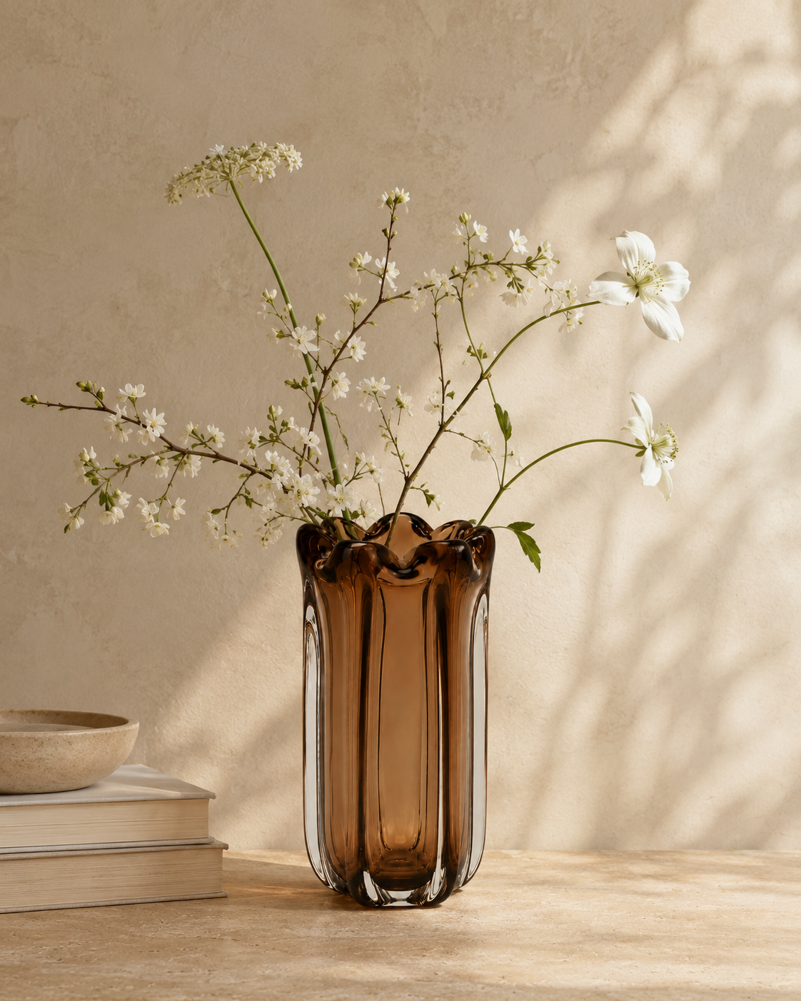 Luna Crown Vase with stems on a tabletop
