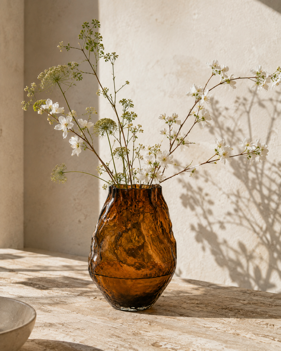 Eden Ripple Vase with stems on a tabletop