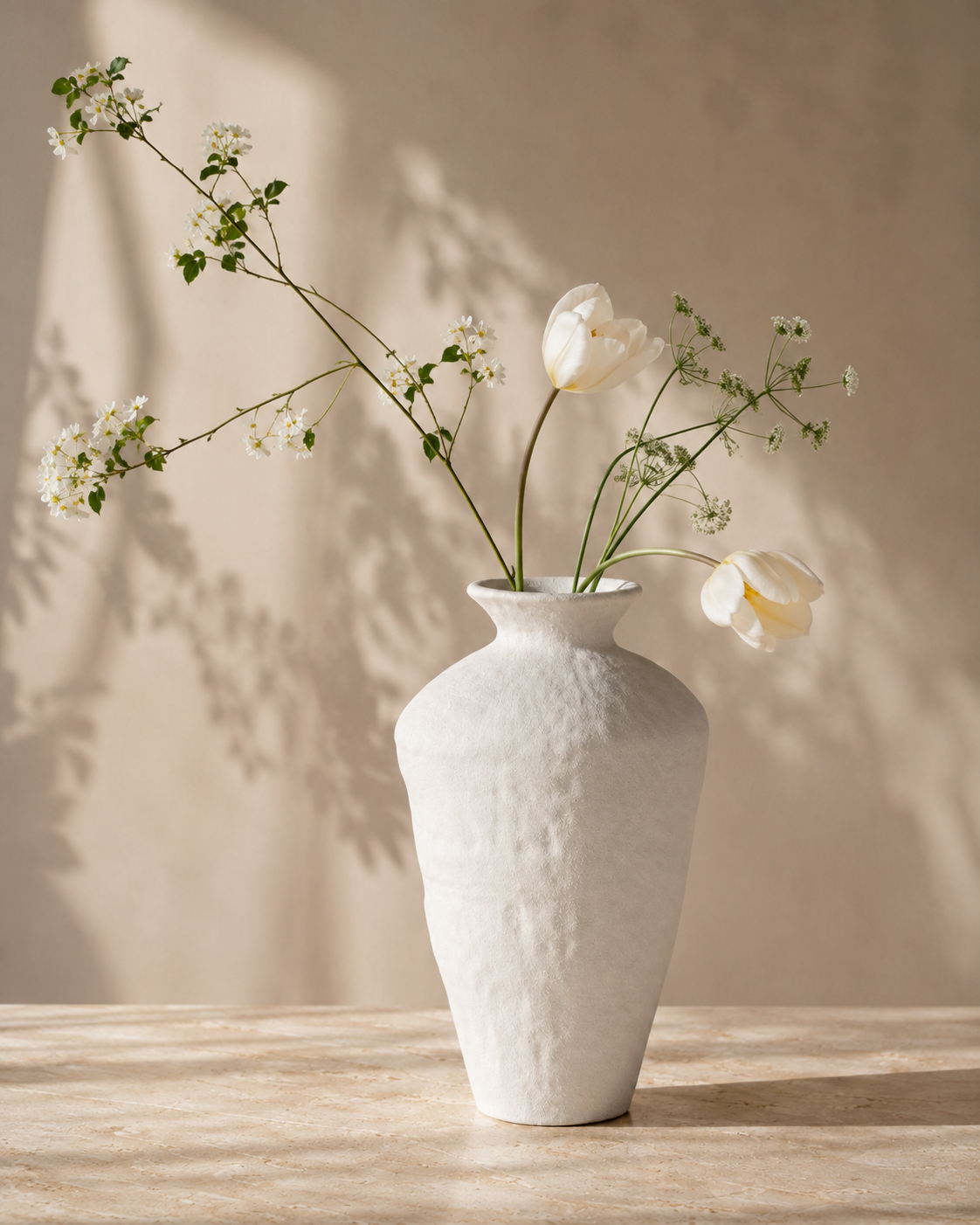 Riva Cloud Vase with stems on a tabletop