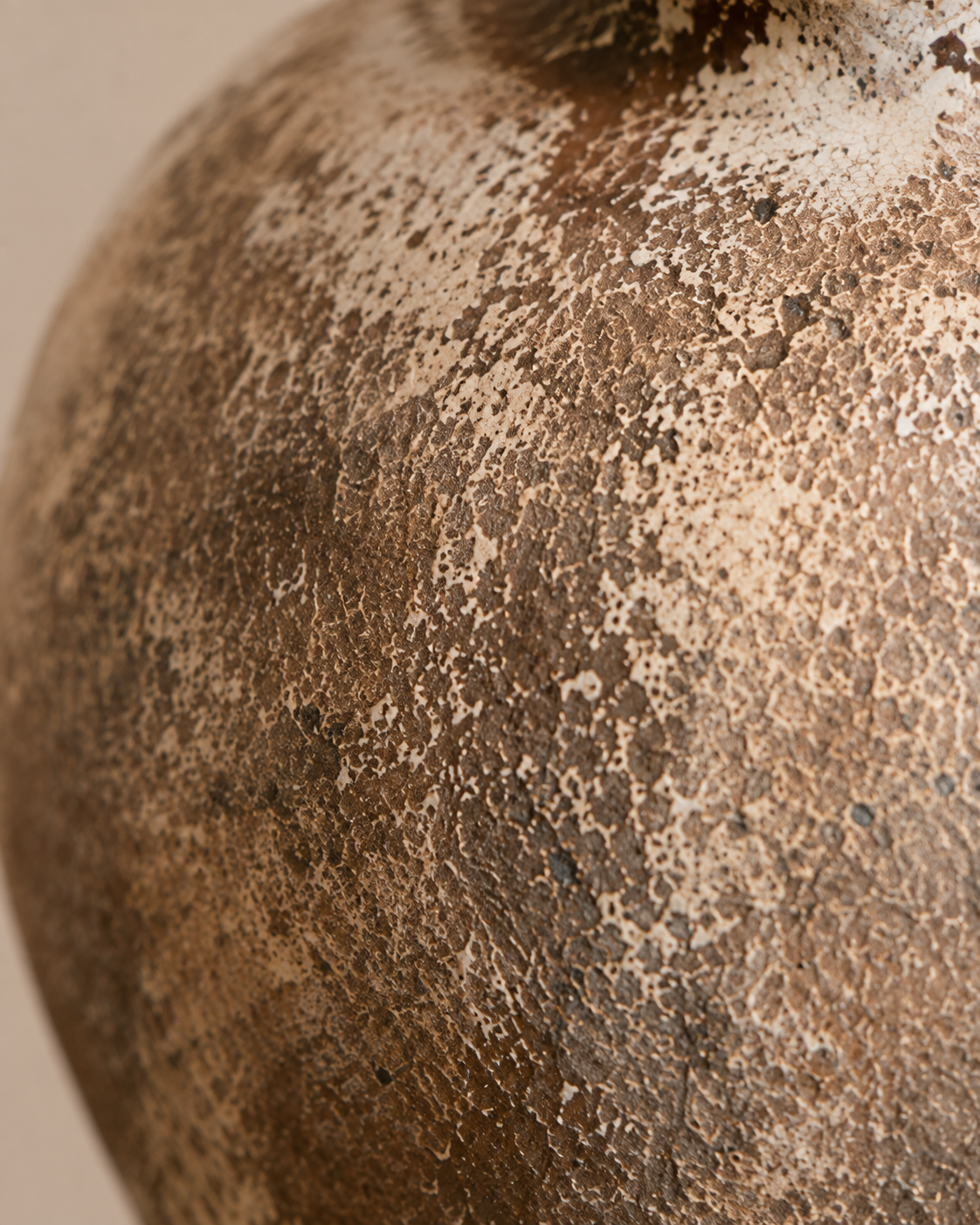 Evia Handle Vase close-up showing mottled brown and cream tones