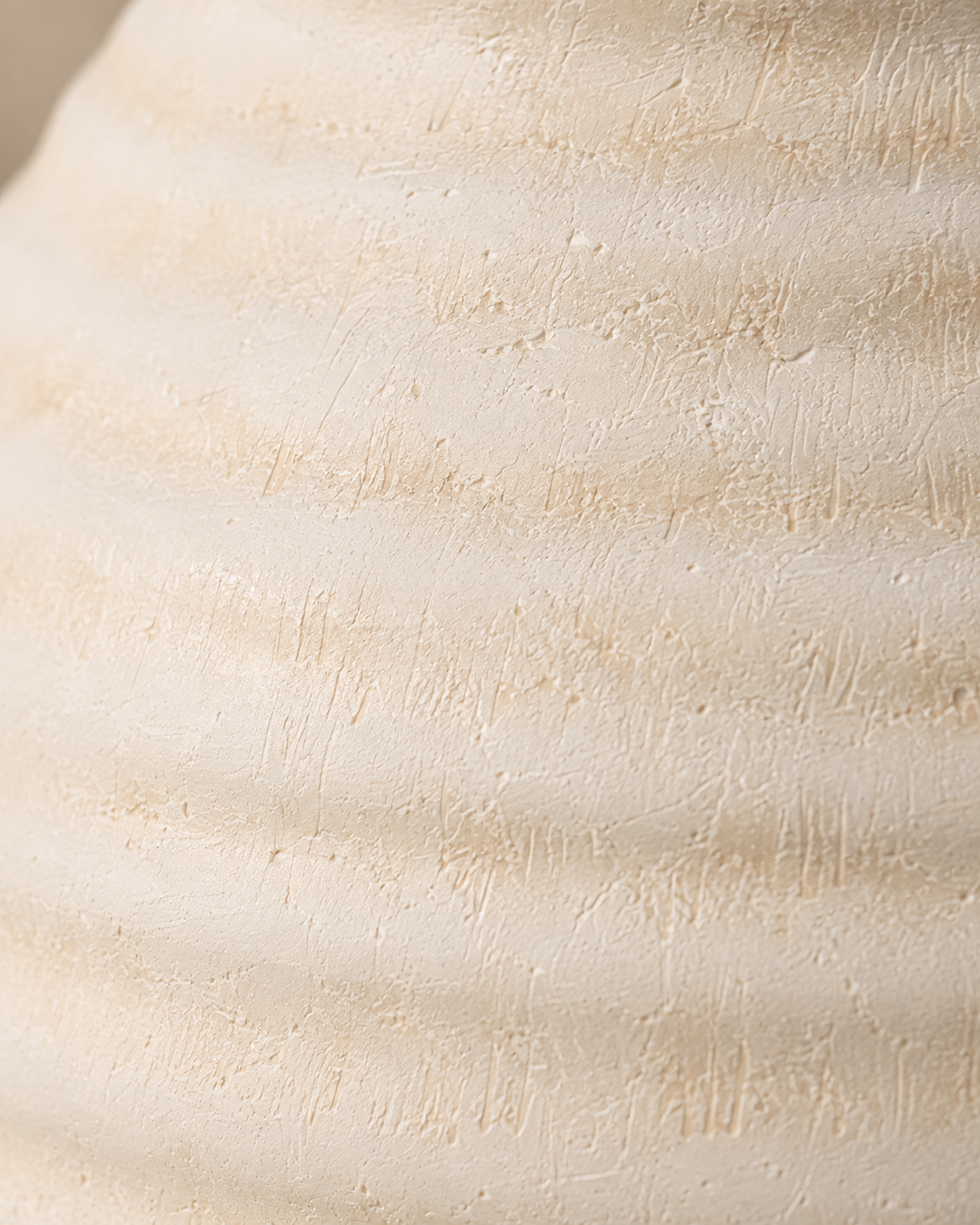 Alea Pitcher Vase close-up showing ivory tone and horizontal ribs