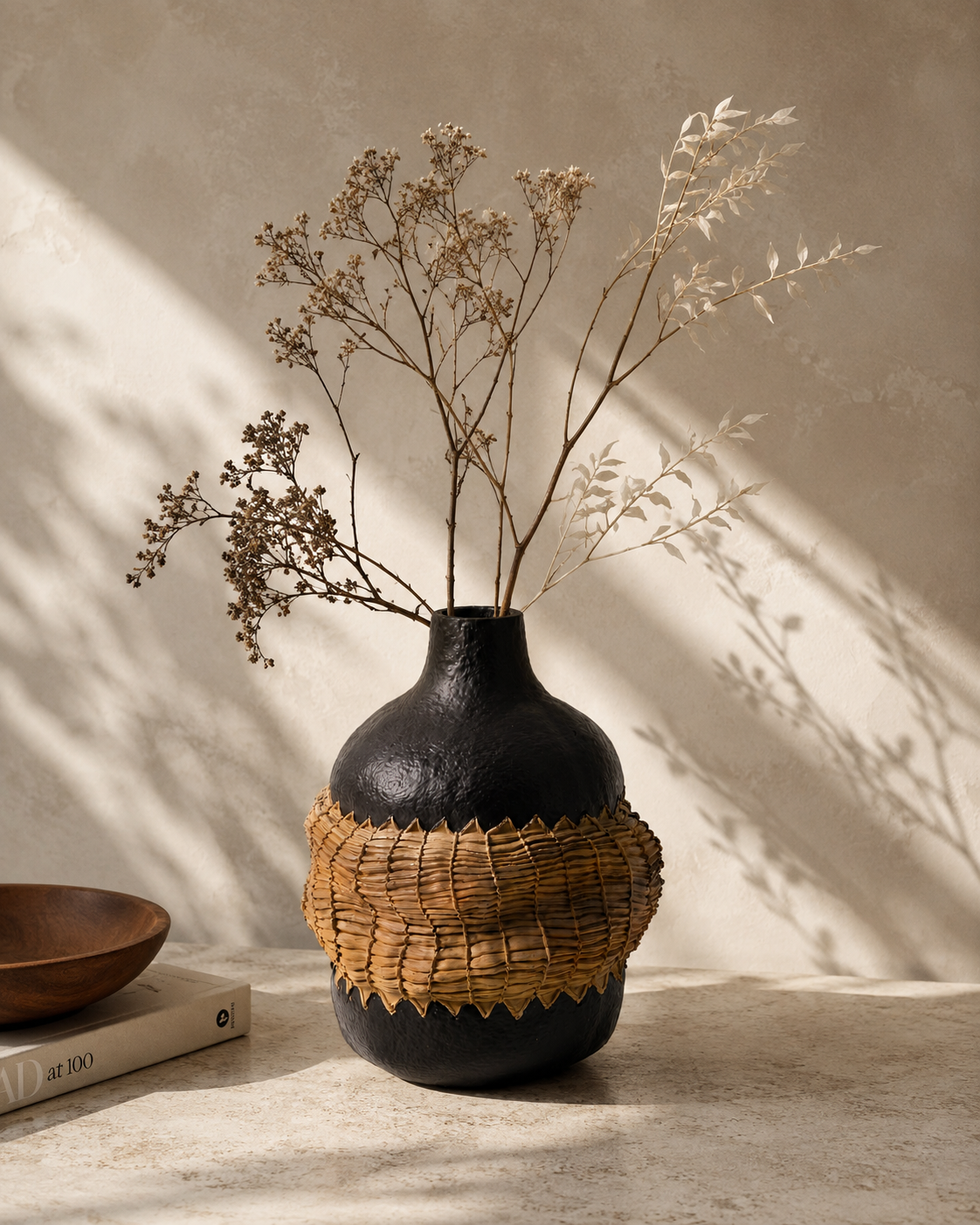 Luna Woven Vase with stems on a tabletop