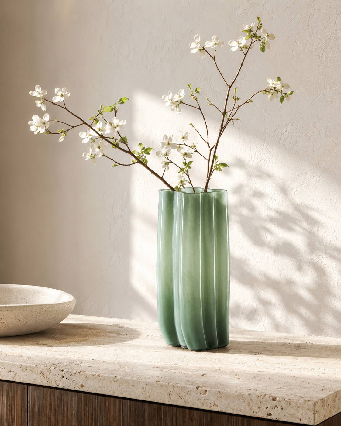 Mina Reed Vase with stems on a tabletop