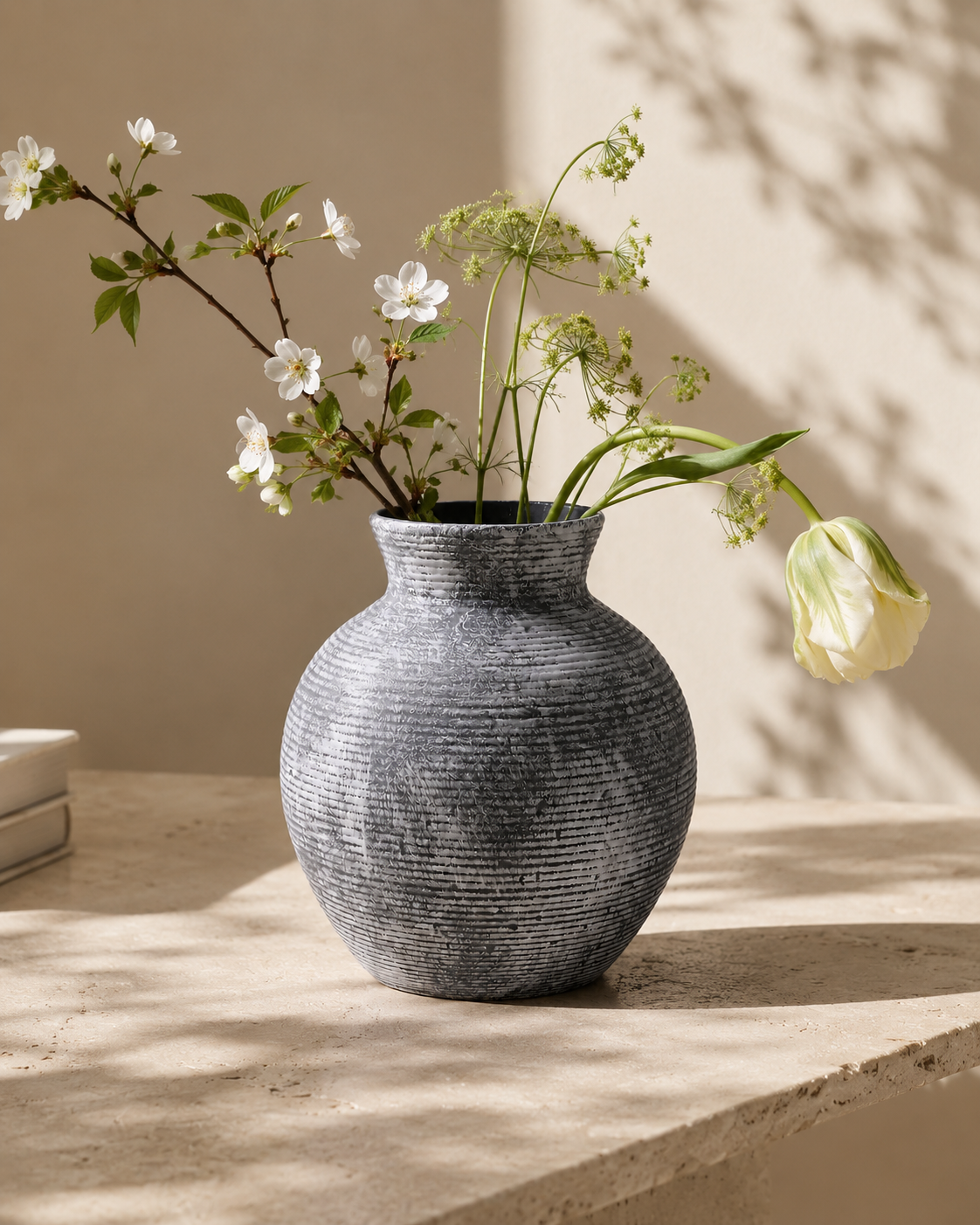 Riva Charcoal Vase with stems on a tabletop