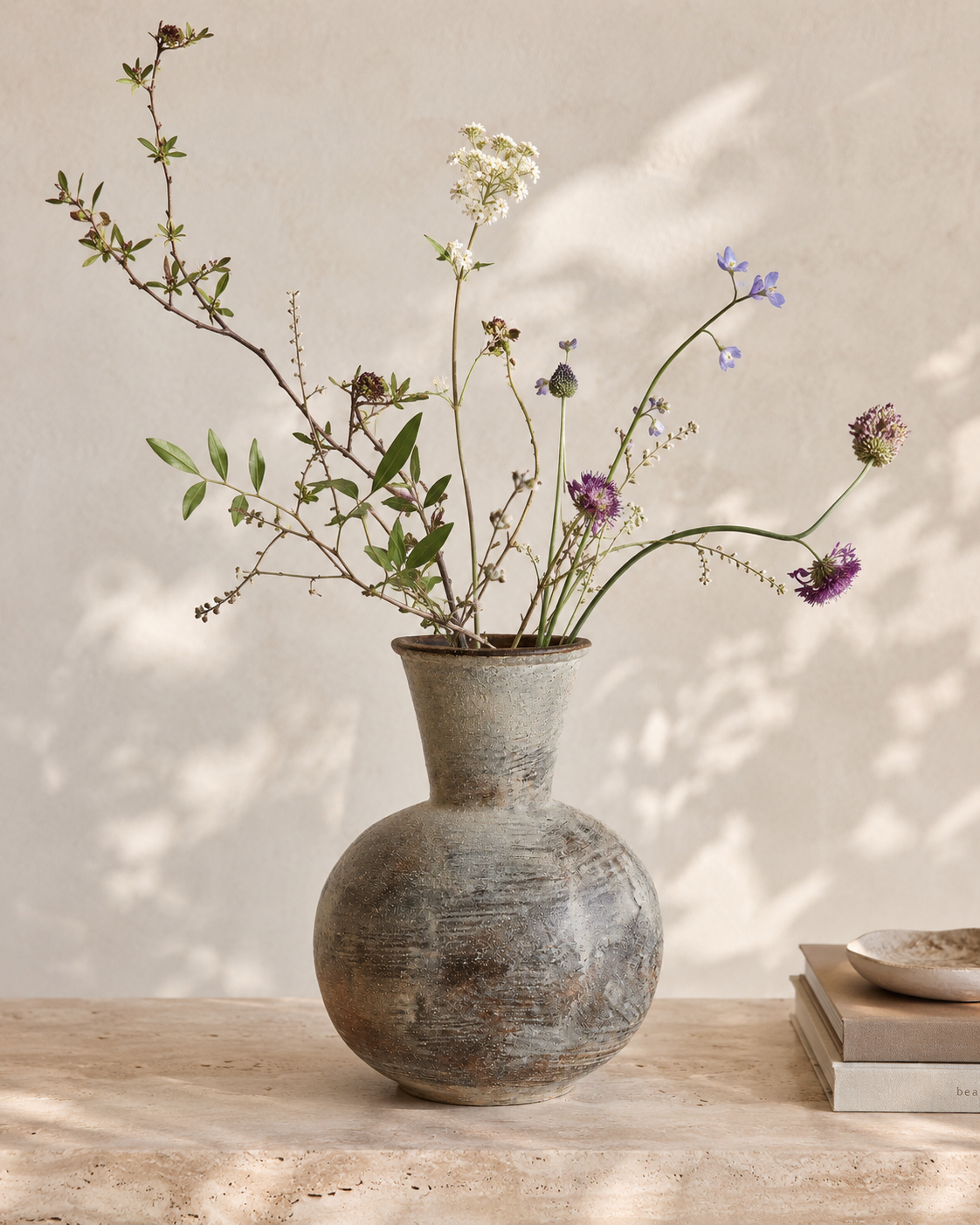 Thea Russet Vase with stems on a tabletop