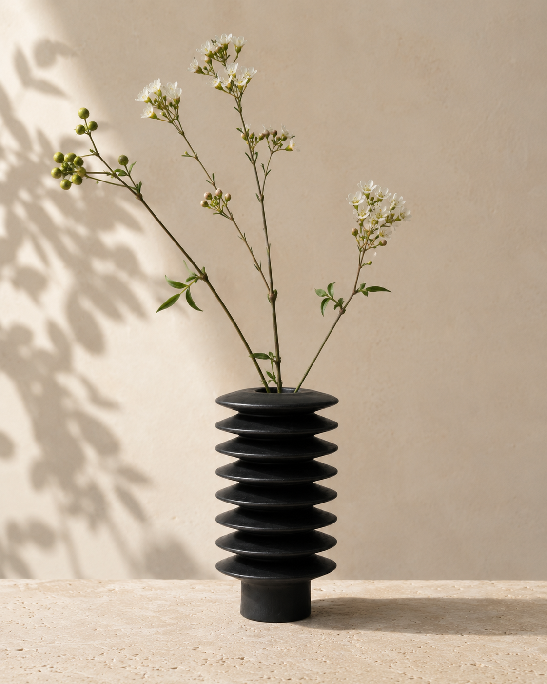 Rina Tier Vase with stems on a tabletop