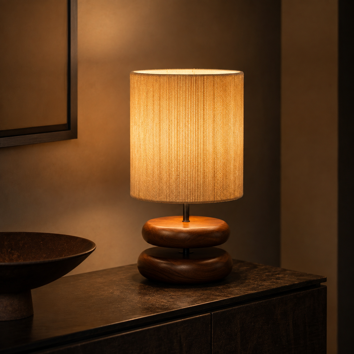 Sienna Sculptural Table Lamp glowing in an evening interior