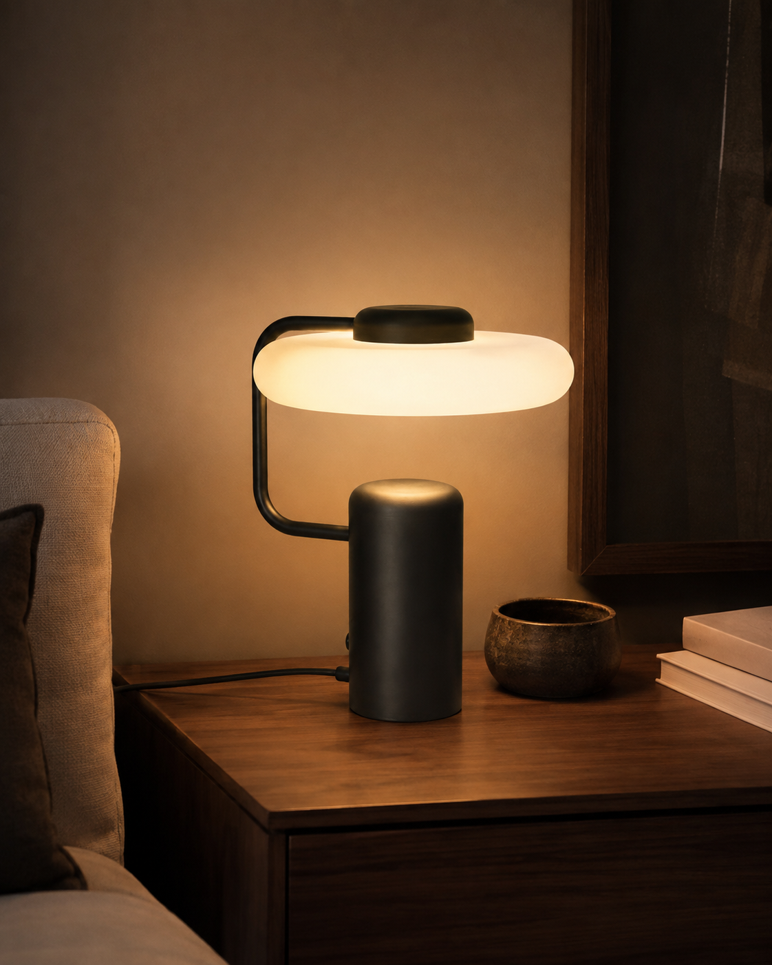 Lisette Sculptural Table Lamp glowing in an evening interior