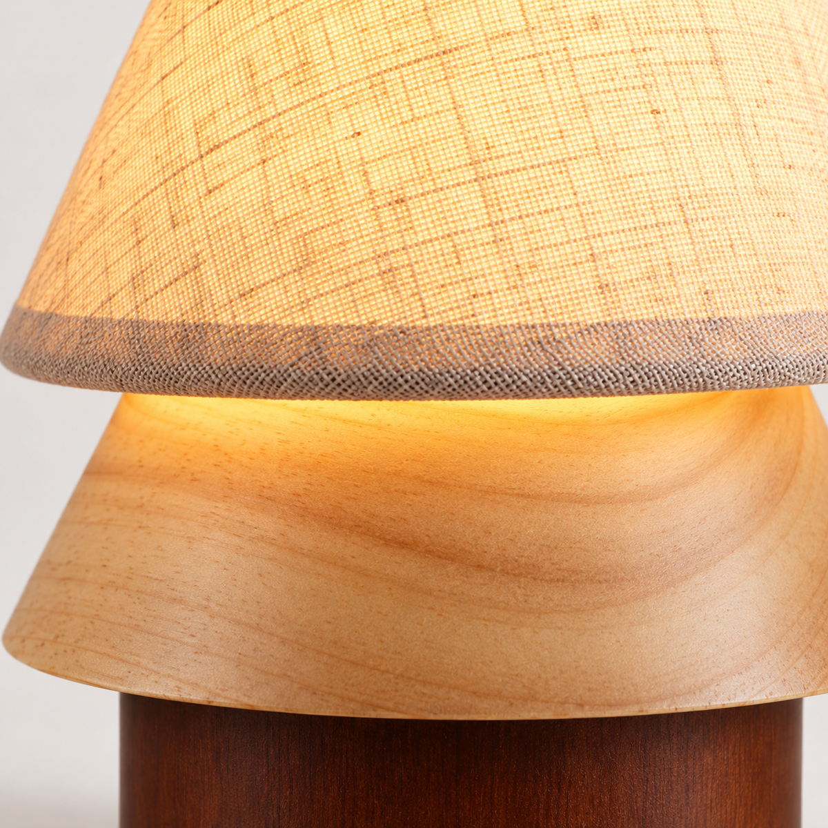 Tova Wood Table Lamp illuminated shade and curved wooden tier