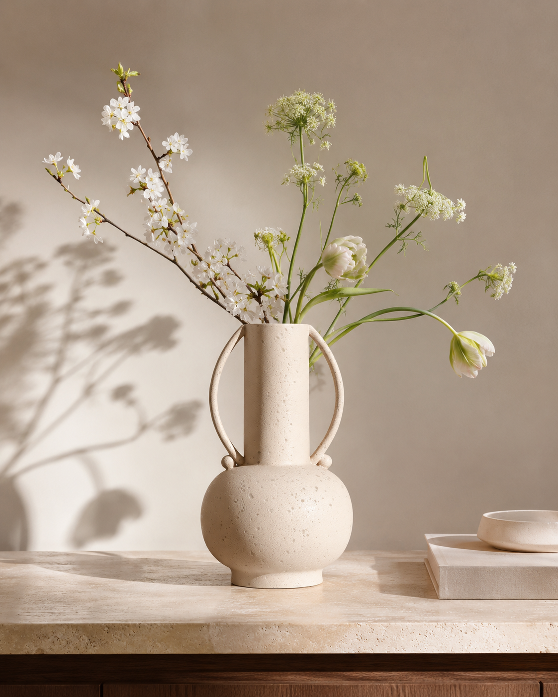 Sora Arch Vase with stems on a tabletop