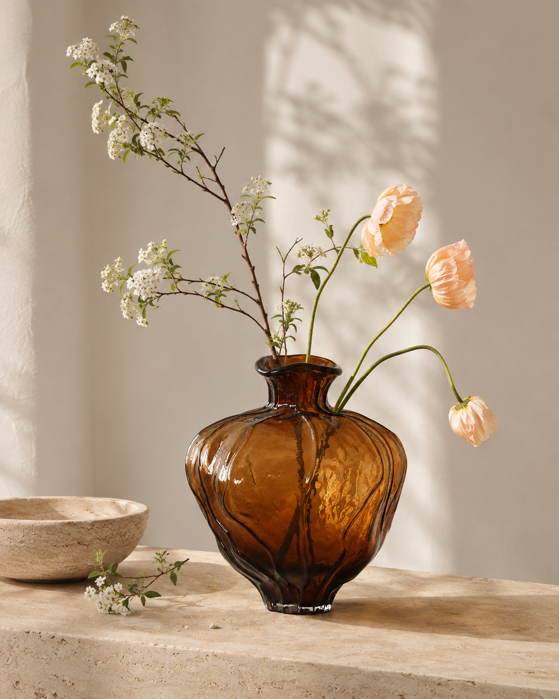 Mina Amber Vase with stems on a tabletop