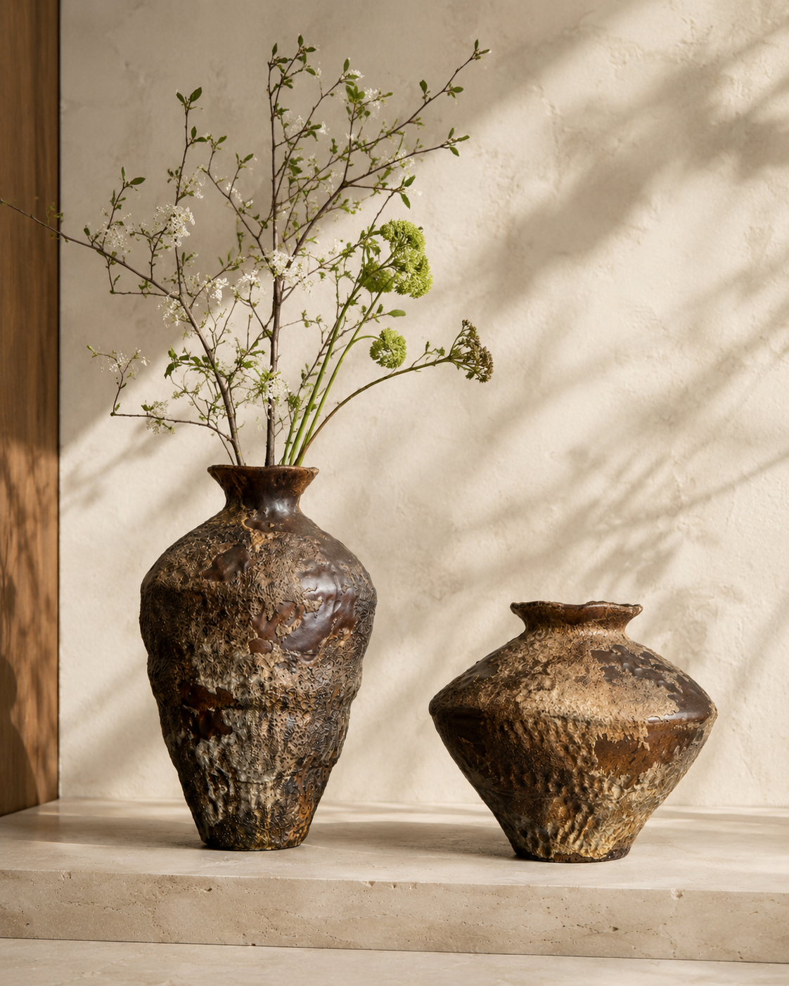Evia Ember Vase with stems on a tabletop