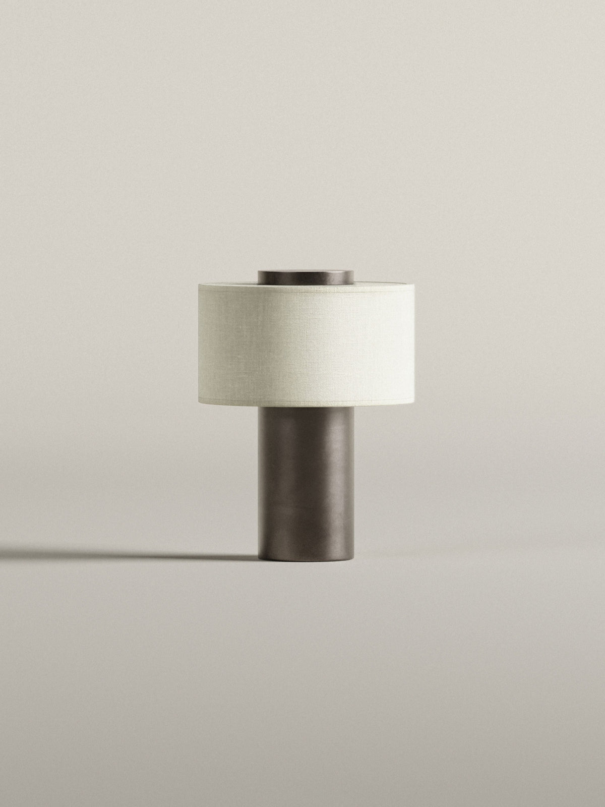 Oriel Bronze Portable Lamp unlit on a plain surface