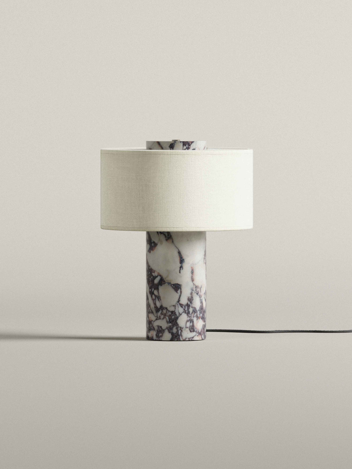 Oriel Calacatta Marble Table Lamp unlit on a plain surface