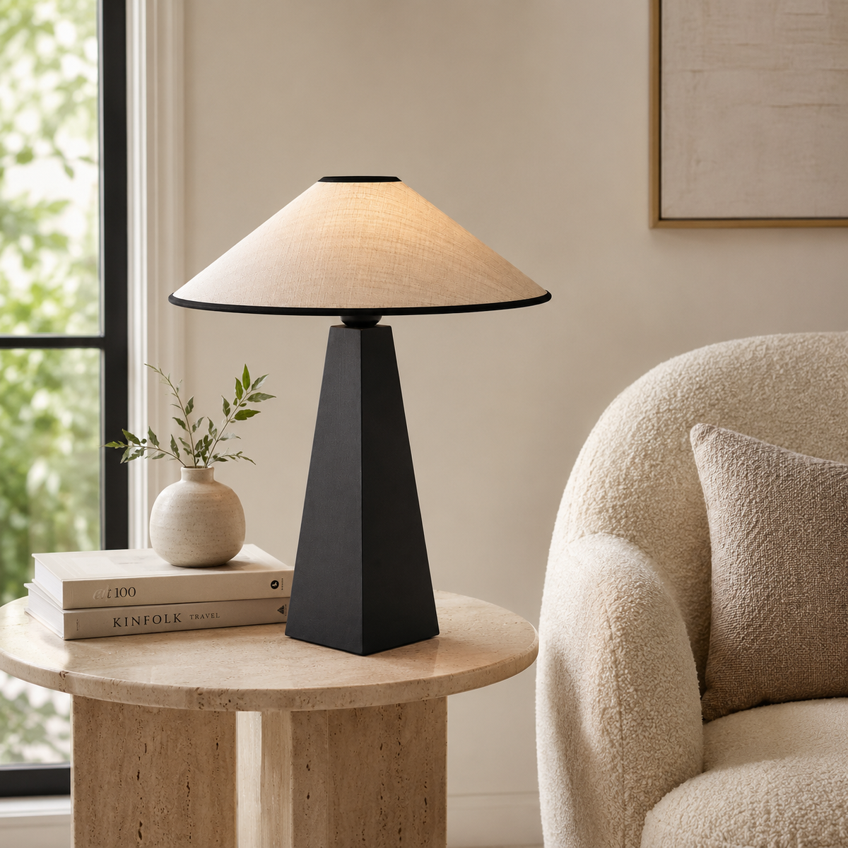 Thea Sculptural Table Lamp on a side table in a living room