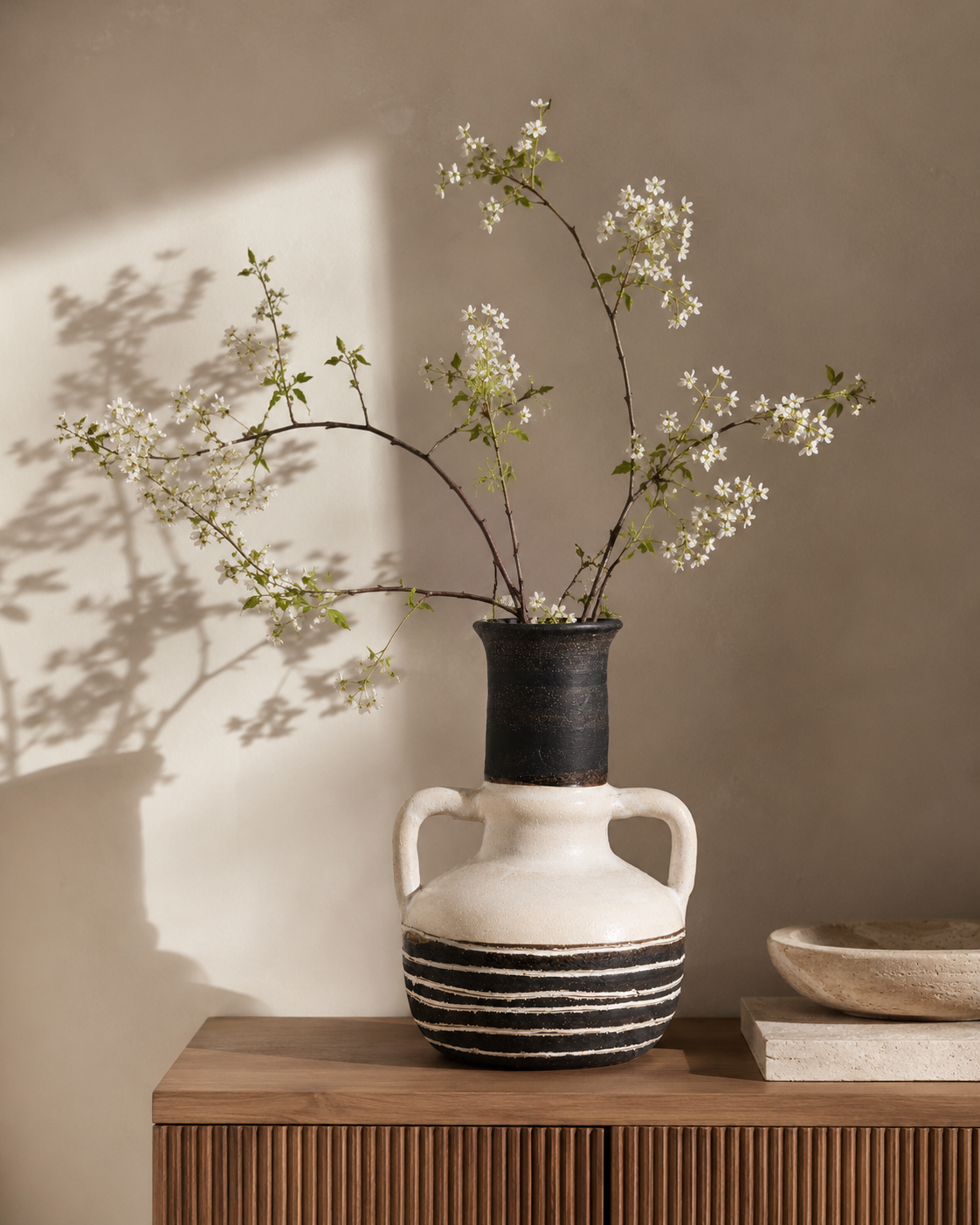 Romy Stripe Vase with stems on a tabletop