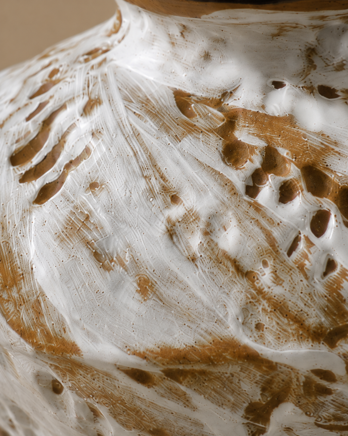 Thea Feather Vase close-up showing pale surface with brown feather-like markings