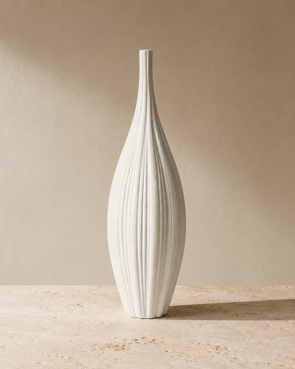 Riva Fluted Vase tall fluted shape on a pale surface