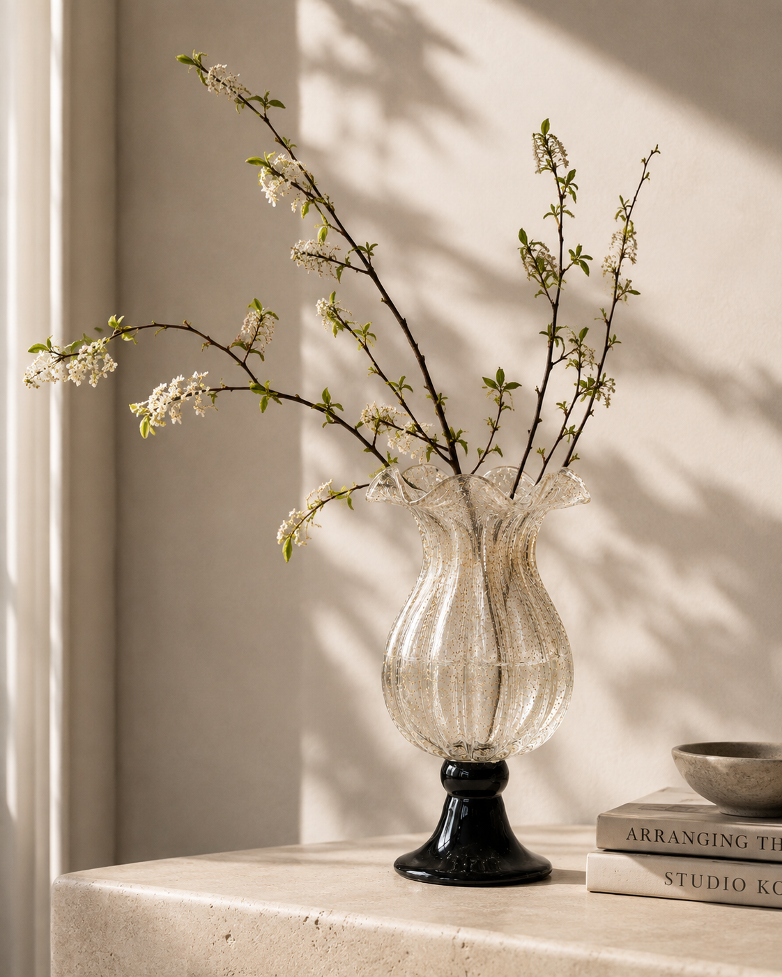 Zara Ruffle Vase with stems on a tabletop