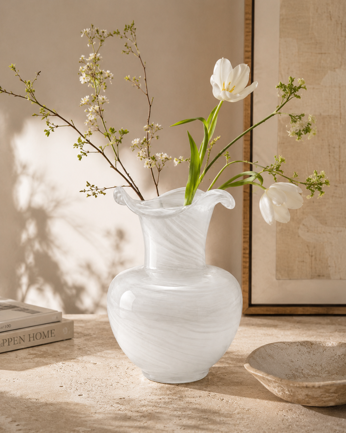 Sora Swirl Vase with stems on a tabletop
