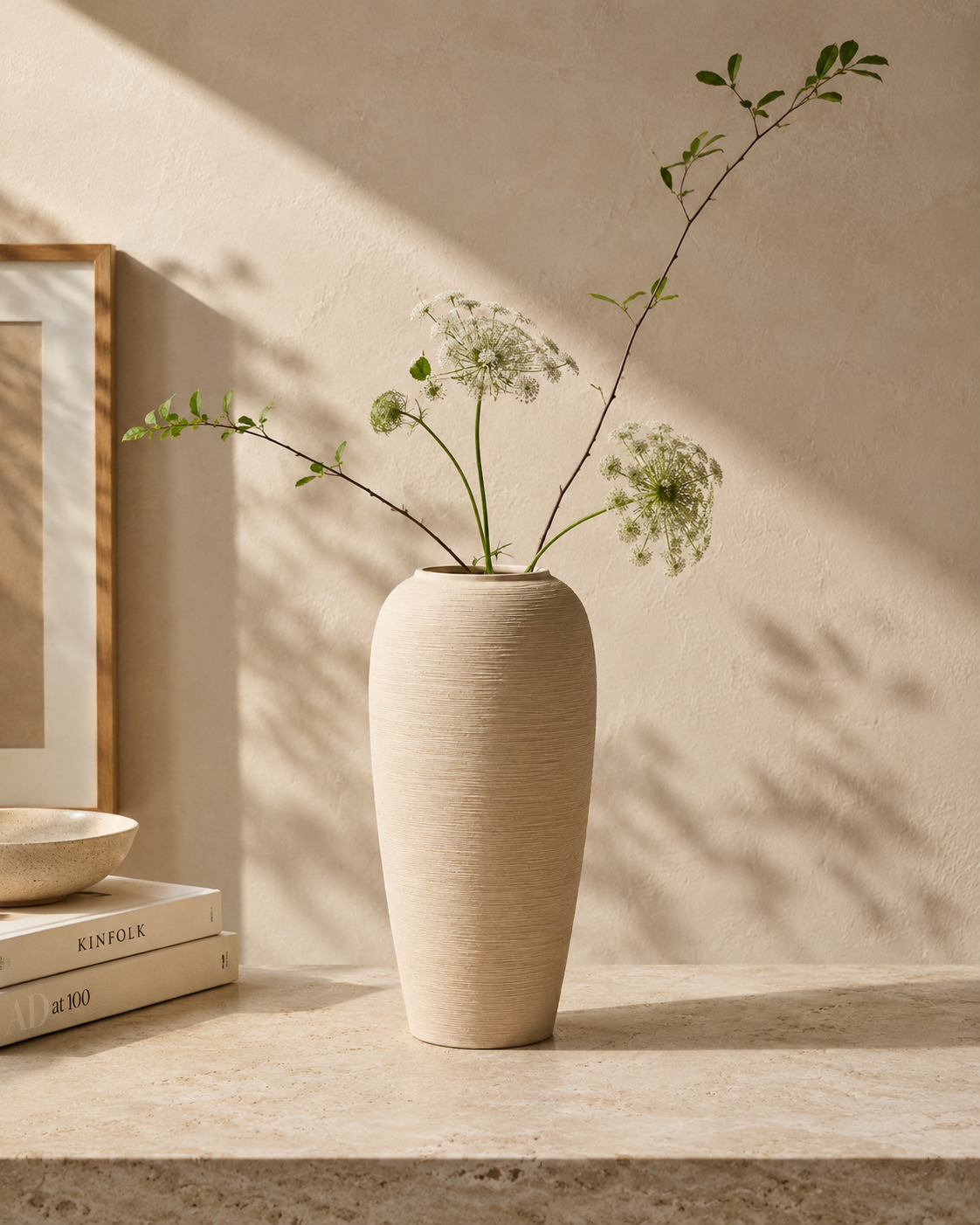 Riva Ridged Vase with stems on a tabletop