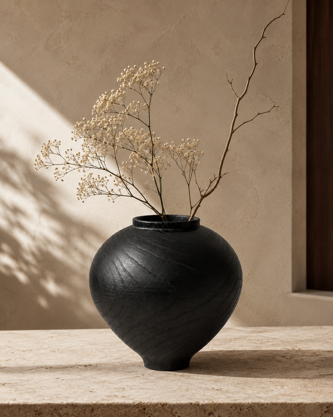 Evia Orbit Vase with stems on a tabletop