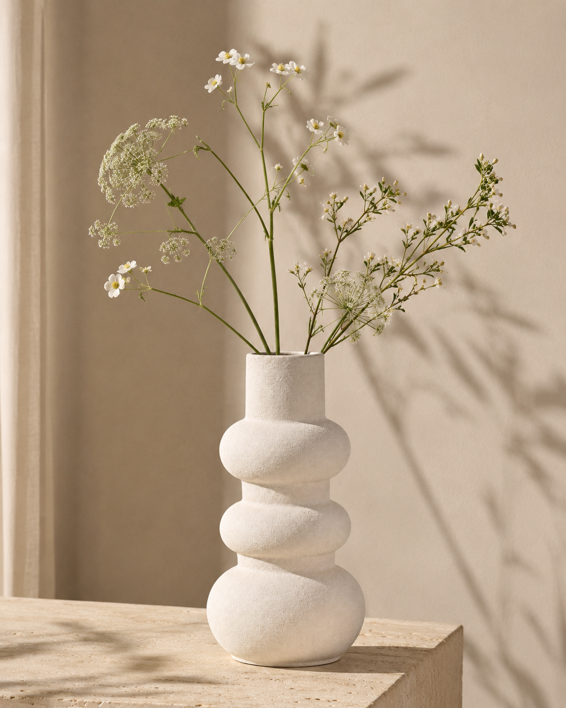 Luna Stack Vase with stems on a tabletop