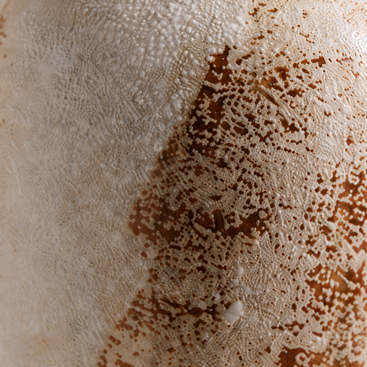 Mina Frost Vase close-up showing pale surface with rusty brown mottling