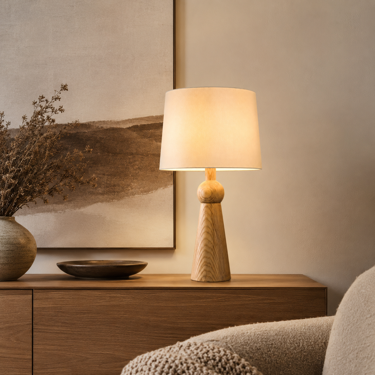 Noelle Bedside Table Lamp on a side table beside a seat