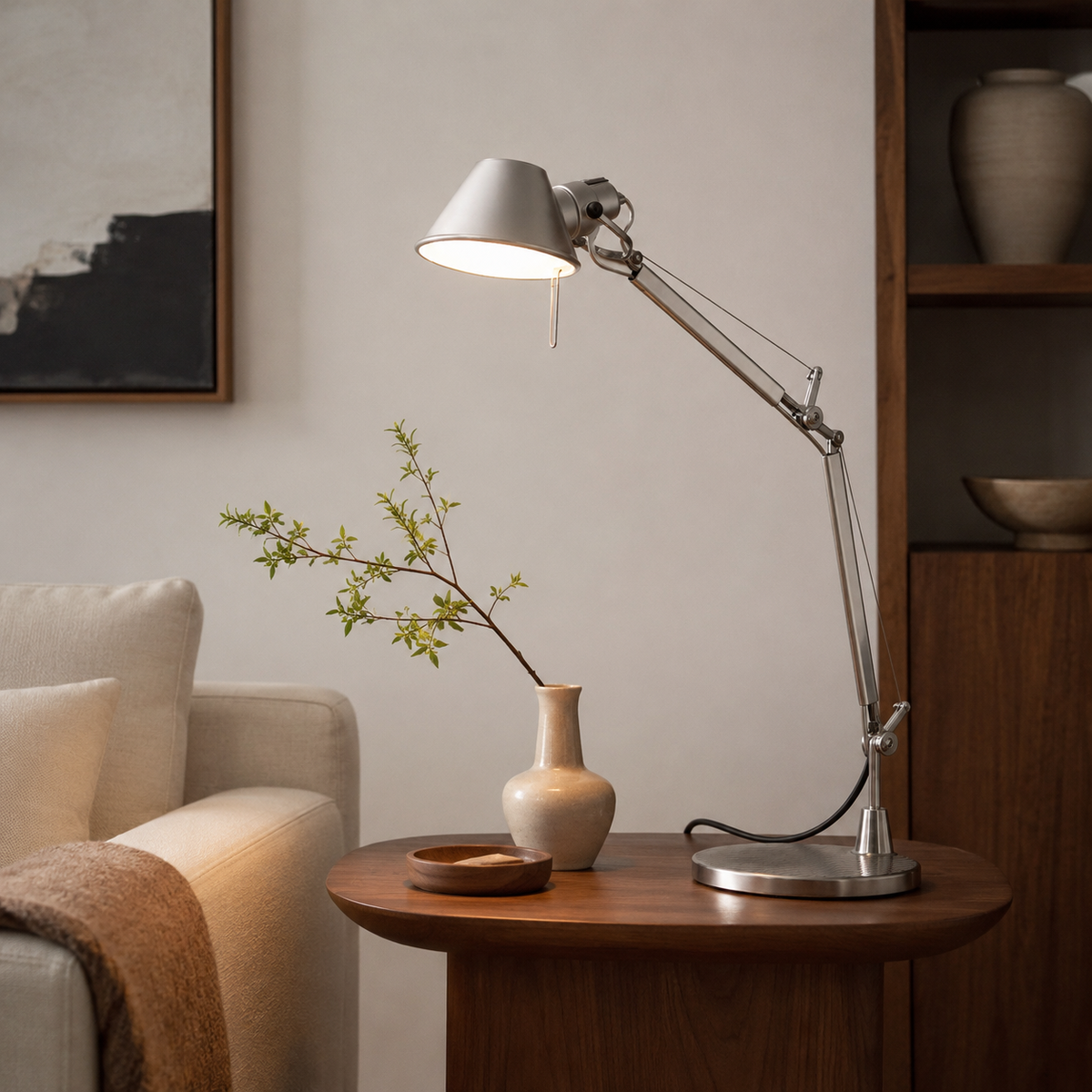 Anais Task Table Lamp on a side table beside a seat