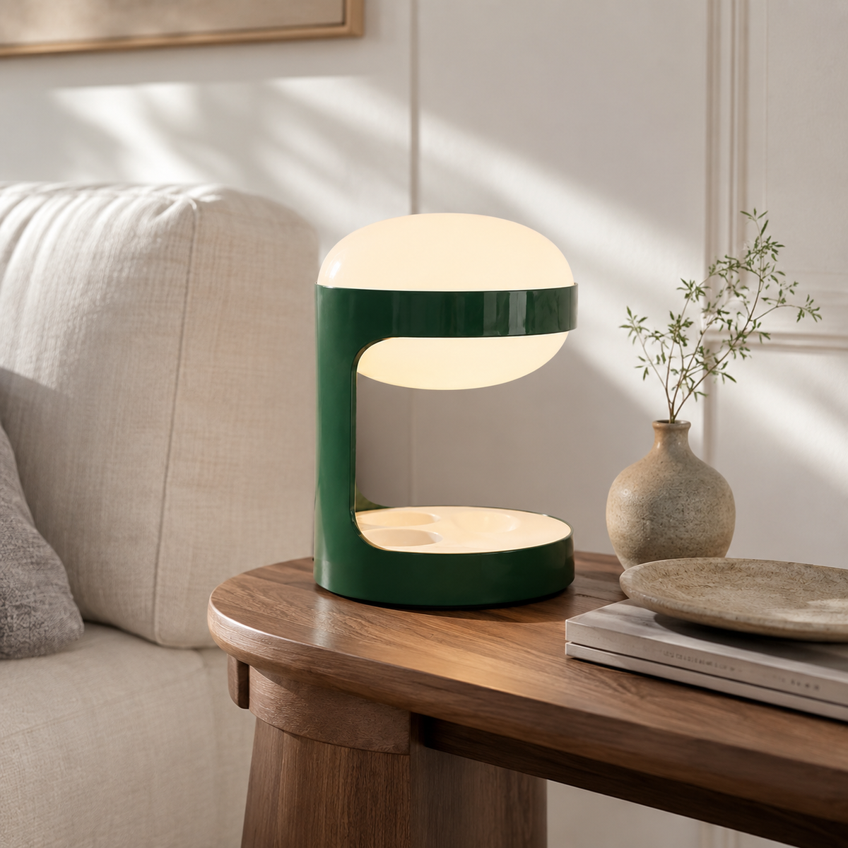 Suri Sculptural Table Lamp on a side table beside a seat