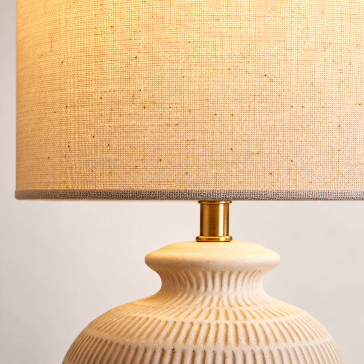 Nila Linen & Stone Table Lamp glowing drum shade and patterned neck