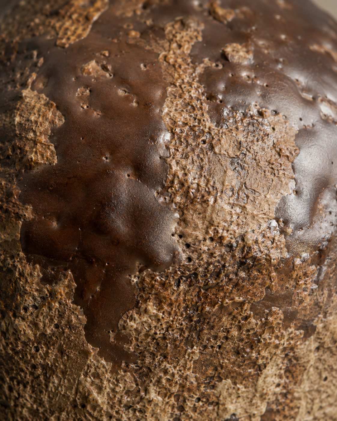Evia Ember Vase close-up showing dark brown tone with lighter mottling