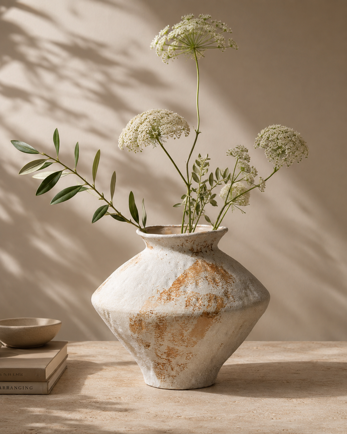 Mina Weathered Vase with stems on a tabletop