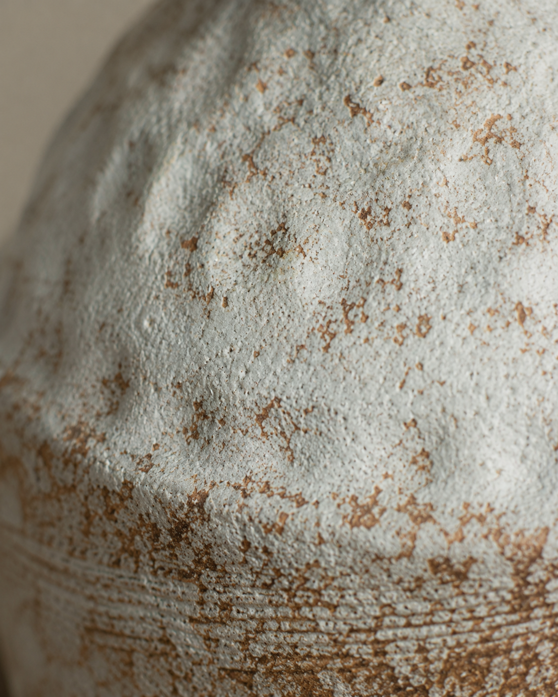 Odea Handle Vase close-up showing pale tones with darker brown mottling