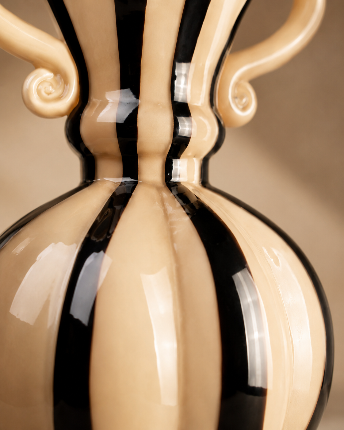Nela Ribbon Vase close-up showing cream and black vertical bands