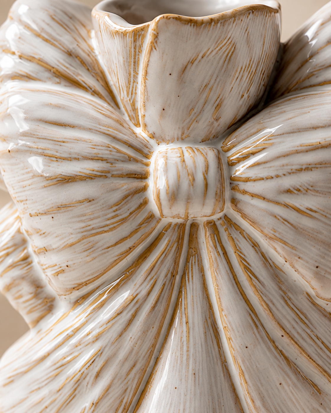 Iris Bow Vase close-up showing large bow motif with flowing tails