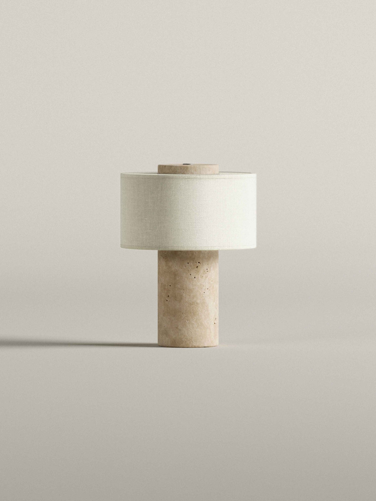 Oriel Travertine Portable Lamp unlit on a plain surface